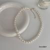 Colar de pérolas de destaque redondo longo Corrente de lã de luxo leve e sofisticado Estilo francês feminino Cadeia de clavícula Acessórios elegantes