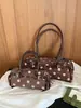 Bolso de axila de lunares estilo coreano de nicho para mujer, nuevo de moda otoño 2026, versátil, de alta gama, para ir al trabajo, de hombro y cruzado