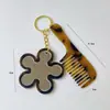 Novo Espelho de Maquiagem Coração Chaveiro Textura Retrô Flor Bolsa Carro Pingente Pente de Cabelo DIY Joia