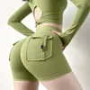 Nuevos shorts de yoga estilo ropa de trabajo transfronteriza con diseño de trasero en forma de durazno, cintura alta, tela elástica, efecto levanta glúteos, cierre de botón y material de secado rápido; hecho a medida