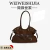 Bolsa de Ombro de Nicho Transfronteiriça de Luxo Feminina 2026 Novo Estilo Moda Simples Bolsa Tote Versátil de Mão para o Trabalho
