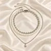 Collar de cuentas multicapa apiladas, estilo punk transfronterizo europeo y americano, dulce y moderno, collar de estrella simple, joyería de perlas de imitación