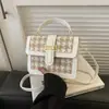 A bolsa pequena popular deste ano para mulheres 2024 Nova moda estilo coreano ins nicho bolsa transversal xadrez de cão bolsa quadrada pequena portátil