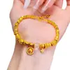 Pulsera de Rueda de Estrella de Diamante Chapada en Oro de Latón Placa de Estrella de Cinco Puntas Lujo Accesible Gama Alta Pulsera de Anillo Corredizo con Cuentas de Transferencia de Oro Arena para Mujeres