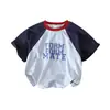 Camiseta de Manga Corta Raglán para Niños Verano 2026 Estilo Nuevo Camiseta Infantil de Bloques de Color de Media Manga Moderna Ropa de Verano para Bebé Camiseta