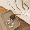 Nuevo Collar de Perlas con Borla de Corazón de Fruta Estilo Chino, Cadena para Suéter Retro Étnica de Lujo Ligero de Gama Alta con un Diseño Único para Mujeres de Nicho