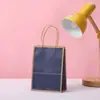 Bolsa de Embalaje de Color Sólido con Borde de Papel Kraft Simple de Alta Calidad Bolsa para Regalo de Fiesta de Cumpleaños Bolsa Portátil de Papel Kraft