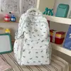 Mochila feminina novo estilo estilo ins, tema floresta, fresca e fofa, com estampa de laço, alto apelo estético, adequada para estudantes do ensino fundamental e médio