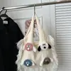 2025 Nuevo Bolso de Mujer Tejido Versátil de Hombro Único de Punto Popular de Comercio Exterior Otoño e Invierno con Bloques de Color Artísticos y Borlas