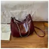 Bolsa de Ombro Única Coreana Bolsa Transversal Mais Vendida Moda Feminina Versátil Casual Bolsa de Balde com Corrente Bolsa Simples de Braço