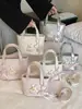 Bolso de mano para mujer con estampado de rombos 2026 nuevo de moda verano moda nicho para ir al trabajo al hombro bandolera cubo