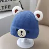 Bonitos y adorables gorros de otoño e invierno para niños, con diseño de poner, material de punto y una serie de dibujos animados, que brindan abrigo y protección para los oídos para bebés y niños pequeños.