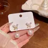 Pendientes de botón de mariposa de circón exquisitos de lujo ligero de nicho de alta gama para mujer, pendientes con colgante de perla de temperamento versátil de moda, joyería para orejas