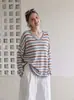 Suéter de punto a rayas con cuello en V y manga larga estilo coreano para mujer, nuevo diseño de otoño e invierno, corte holgado, adecuado para usar en capas o como prenda exterior.