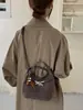 Bolso de mano de nicho estilo coreano para mujer, nueva colección de invierno 2026, bolso de hombro retro, adecuado para el trabajo y los desplazamientos, bolso tipo cubo