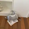 Bolsa de bolos para mujer, nuevo estilo coreano de moda primavera 2026, bolso de mano de alta gama versátil para el hombro y cruzado para el trabajo
