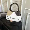 Bolso de mano cruzado de un solo hombro con bloques de color, lindo y adorable, para niña, moda nueva primavera 2026, versátil, con estampado de gato de dibujos animados, elegante
