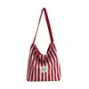Bolso de Lona Rayado de Gran Capacidad para Mujer 2026 Nuevo Estilo Coreano Bolso de Hombro para el Trabajo Bolso Tote Versátil Casual para la Universidad