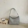 Bolso de axila de textura tejida de nicho estilo coreano transfronterizo para mujer, nuevo popular de verano 2026, bolso versátil de hombro y cruzado tipo bola de masa