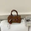 Bolsa de almohada reductora de edad estilo coreano 2026 nueva bolsa de boliche, bolso de hombro/cruzado moderno y versátil, bolso de mano para mujeres de nicho