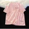 2026 Nuevo Conjunto Deportivo de Verano para Mujer Rosa Manga Corta Shorts Moda Running Dos Piezas para Personas Pequeñas