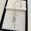 Collar Colgante Corazón Rústico con Borla para Mujer Diseño de Nicho Cadena Larga de Cuerda de Cuero Accesorios de Estilo Étnico