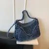Bolsa de ombro casual e fashion transfronteiriça 2026 novo estilo coreano com detalhes de rebites, bolsa jeans feminina para o dia a dia