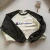 Nueva sudadera de cuello redondo para hombre y mujer, top tipo camiseta de manga larga, corte holgado con bordado en inglés, sudadera de marca versátil y moderna estilo coreano para hombre
