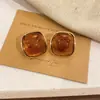 Pendientes de Botón Ovalados de Resina Transfronterizos Europeos y Americanos Pendientes Maillard de Otoño e Invierno Pendientes Simples de Moda Versátiles para Mujer Sensación de Alta Gama