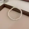 Pulsera elástica de perlas simple retro francesa Pulsera de moda de lujo ligero francesa Pulsera de temperamento versátil para el día a día venta al por mayor