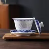 Jingdezhen Color Bajo Esmalte Pintado a Mano Azul y Blanco Exquisito Tazón con Tapa Kung Fu Juego de Té Auténtico Porcelana Blanca Alta Alta Temperatura Juego de Té Caja de Regalo