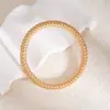 Conjunto de pulseira e colar estilo luxo transfronteiriço europeu e americano, com design em espiral e múltiplas camadas.