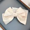 Clip de resorte con lazo de perla, accesorio para el cabello de alta gama, elegante y francés para celebridades de Internet.