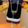 Collar de cuentas de cristal de lujo ligero de Corea del Sur Cadena de suéter de nicho de lujo ligero para mujer Accesorios de cadena para clavícula con lazo de alta calidad