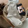 Nuevos calcetines holgados de estilo coreano ins de color liso versátiles con diseño calado en color marrón avena, calcetines básicos de algodón hasta la mitad de la pantorrilla para mujer