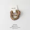 Tiara de Cabelo com Estampa de Leopardo e Inserção de Cartão Estilo Coreano para Mulheres 2026 Novo Toque de Luxo Prendedor de Coque Elástico de Renda Acessórios de Cabelo