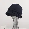 Sombrero de cubo plisado estilo coreano de alta calidad para mujer, moderno y versátil para primavera y otoño, sombrero protector solar posparto, sombrero holgado, sombrero retorcido que hace que la cara parezca más pequeña