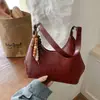 Bolso Cruzado de Hombro Único con Colgante Texturizado Color Sólido Casual Estilo Coreano Verano 2026 Nuevo Elegante Bolso Dumpling para Mujer