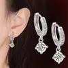Yihua AliExpress pendientes de comercio exterior joyería al por mayor pendientes de un solo taladro de cuatro garras fábrica directa una generación de cabello