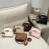 Bolso de Mano Cuadrado Pequeño Casual Simple Estilo Coreano para Mujer 2026 Nuevo Modelo de Primavera Bolso de Hombro Cruzado de Alta Calidad Elegante