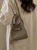 Bolsa Balde Simples de Mão Estilo Coreano para Mulheres Inverno 2026 Nova Versátil Elegante Textura de Alta Qualidade Bolsa de Ombro Transversal