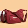 Tendencia transfronteriza bolsa ligera de nailon 2026 primavera bolso casual para mujer bolso de hombro de color liso bolso cruzado de compras para mujer