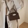 Bolso de Mano Pequeño Elegante de Gama Alta para Mujer 2026 Nuevo Bolso Cruzado Versátil Bolso Tote Pequeño Kelly Super Popular de Moda