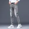 Temporada de primavera y otoño, pantalones de mezclilla grises para hombre, elásticos, modernos, corte ajustado, pierna cónica, estilo europeo, con estampados únicos, pantalones largos casuales