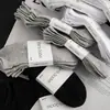 Meias lisas para mulheres, meias curtas para homens, meias esportivas, meias pretas e brancas, meias de estudante, meias de casal, meias versáteis para viagem, meias de tornozelo, indústria de meias de Zhuji