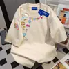 Versión Coreana Hellokltty Camiseta Divertida con Estampado de Graffiti de Letras para Mujer Verano 2025 Estilo Caliente Top de Cuello Redondo