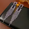 Brincos de Agulha de Prata Estilo Europeu e Americano com Círculos Cravejados de Diamantes e Franjas, Toque de Luxo Leve e Alto Padrão, Brincos Exagerados de Nicho com Design Único