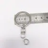 Llavero de Metal con Hebilla de Figura 8, Niquelado, Anilla Giratoria de 25 mm, Anilla Plana con Diseño de Figura 8, En Stock, Llavero de 2.5 mm