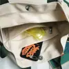 Bolso de Hombro para Mujer y Hombre 2026 Nueva Moda Nicho Color Sólido Bolso de Clase para Estudiantes Gran Capacidad Lona Casual Bolso Cruzado