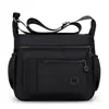 Bolsa de maternidad multicapa de nailon, elegante y minimalista, impermeable, versátil, casual, ligera y se puede llevar como bolso de hombro o bolso cruzado.